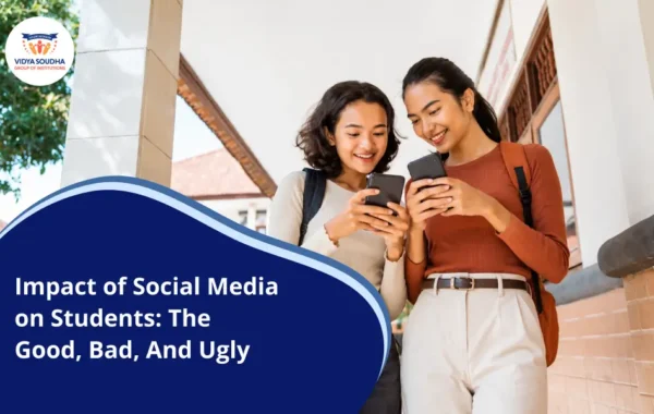 Two students checking social media on their phones