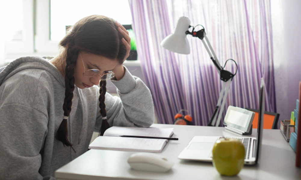 Student showing symptoms of study burnout like stress and fatigue